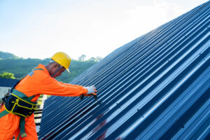 a man working on a metal roof - Gravimetric Testing Services