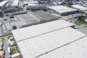 an aerial view of an industrial building with a parking lot - Forensic Testing Services