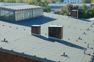 a roof with chimneys and trees - Delamination testing Service